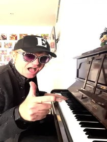 Poster for Anniversary video from Elton John Impersonator