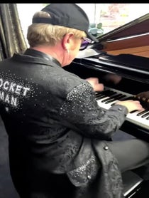 Poster for Pep Talk video from Elton John Impersonator