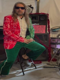 Poster for Holiday video from Stonehenge Air Guitarist